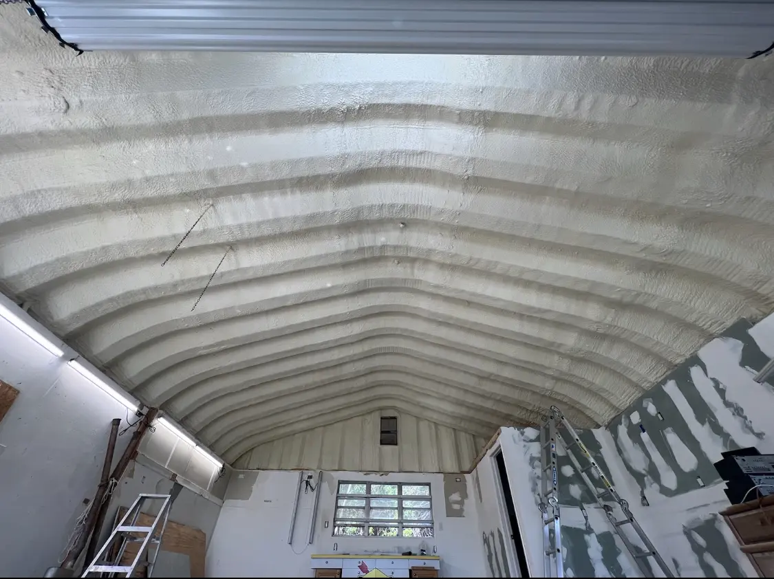 Spray polyurethane foam applied to the underside of a metal roof deck in Nottingham